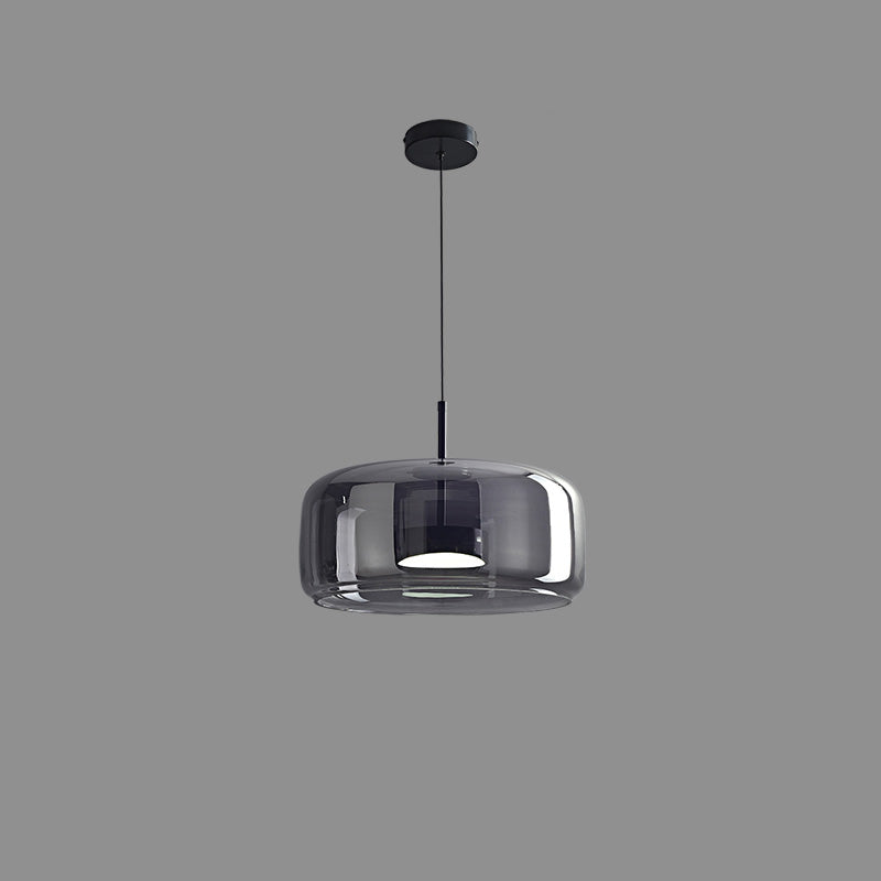 Suspension lumineuse en verre soufflé, design élégant et moderne.  Luminaire intérieur, forme tambour, ambiance chaleureuse.