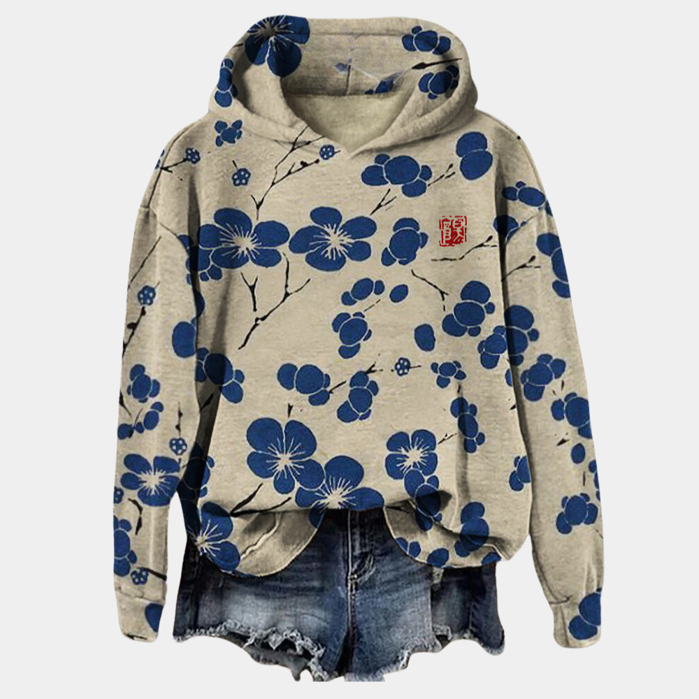Sweat à capuche femme Kaori fleuri, motif floral élégant pour un style décontracté chic mi-saison.