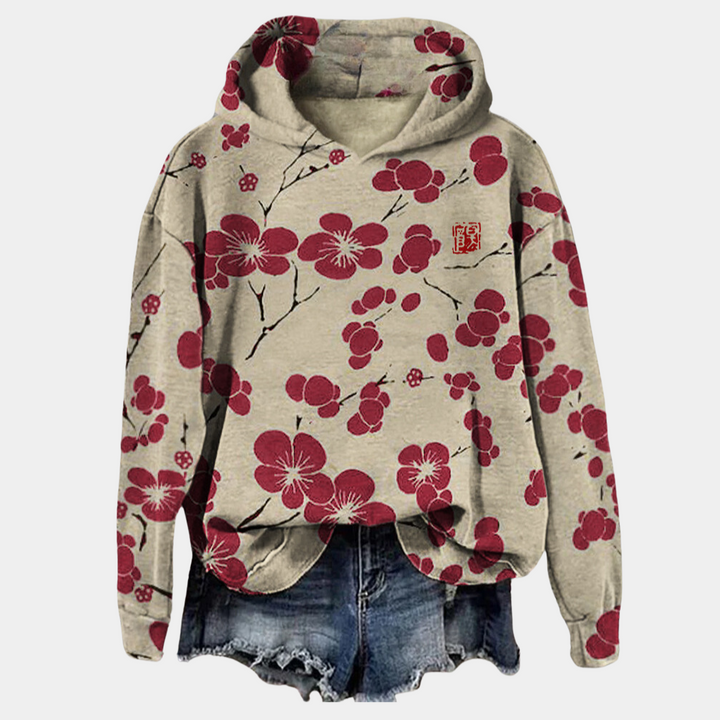 Hoodie femme Kaori confortable, imprimé floral chic. Idéal pour un look décontracté et élégant.