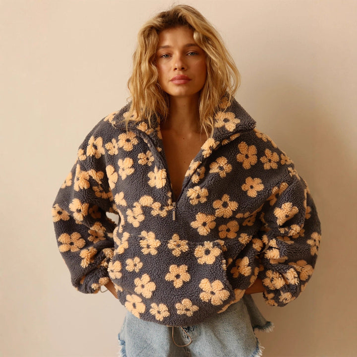 Haut polaire zippé pour femme, coupe ample et confortable, idéal pour un style casual avec sa poche.