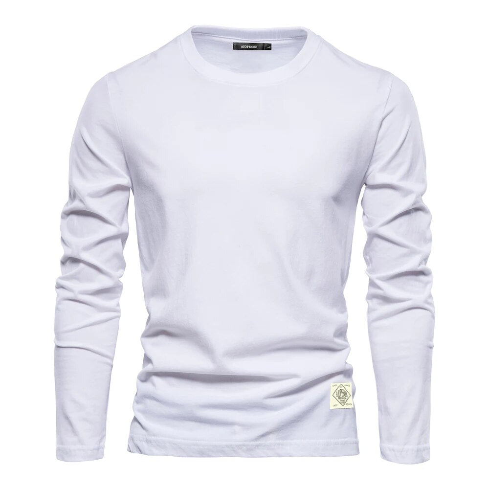 T-shirt femme basique à manches longues, col rond, couleur unie. Idéal pour le confort quotidien et un style décontracté.