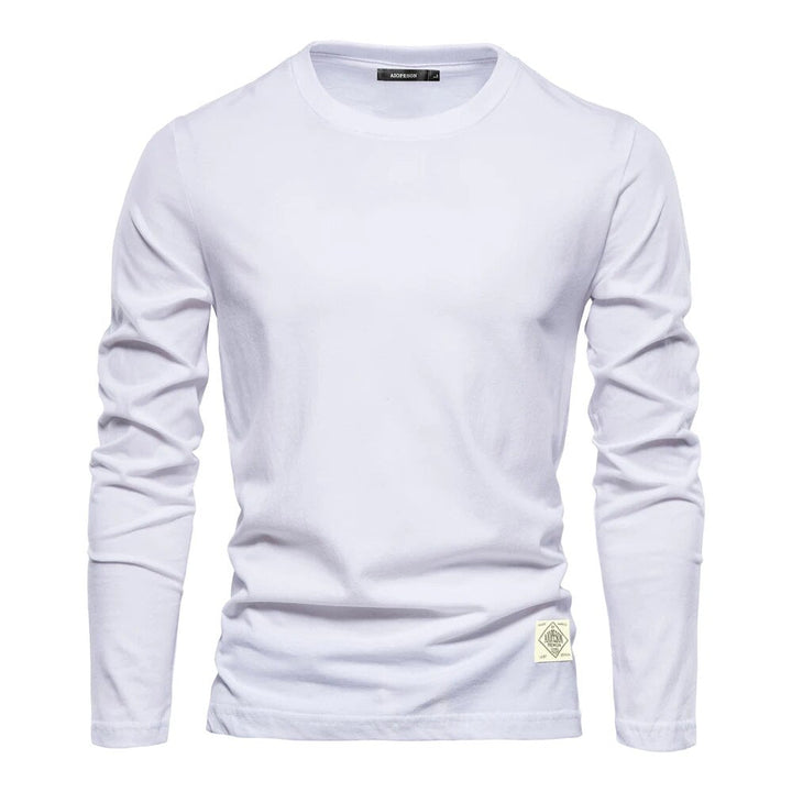 T-shirt femme basique à manches longues, col rond, couleur unie. Idéal pour le confort quotidien et un style décontracté.