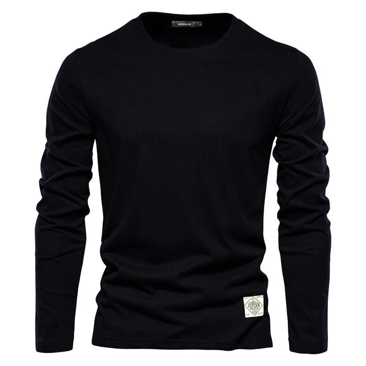 T-shirt femme élégant à manches longues, col rond. Haut basique et confortable, parfait pour un style intemporel et polyvalent.