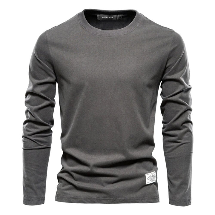 T-shirt femme basique à manches longues, col rond. Confort maximal pour ce haut décontracté, idéal pour toute saison.