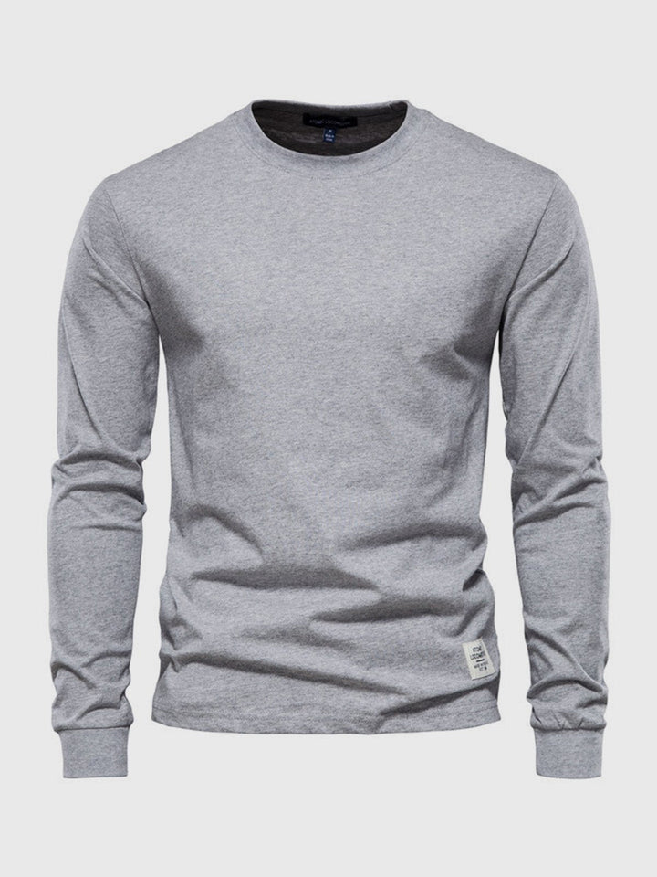 Élégant t-shirt homme à col rond et manches longues, pour un confort optimal et un style simple.