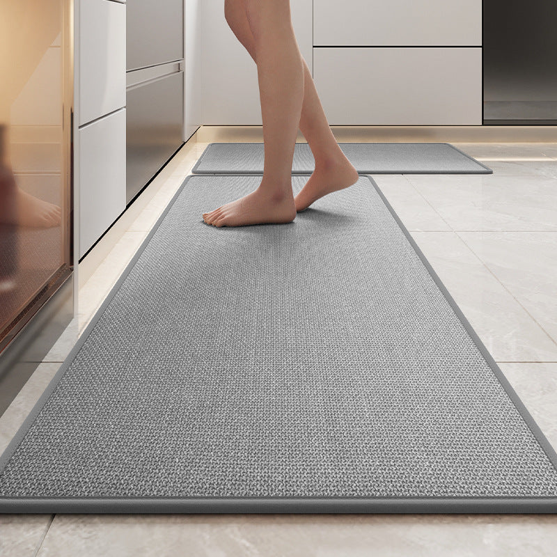"Tapis de cuisine en lin tressé, antidérapant, couleur gris, sur sol de cuisine, offre confort et sécurité."