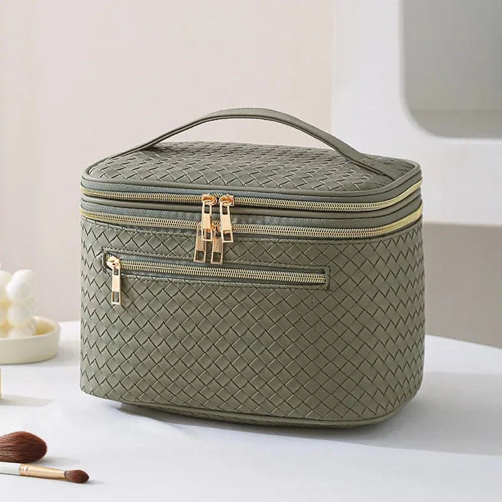 Trousse cosmétique en cuir PU noir, chic et fonctionnelle, parfaite pour le rangement des essentiels beauté féminins.