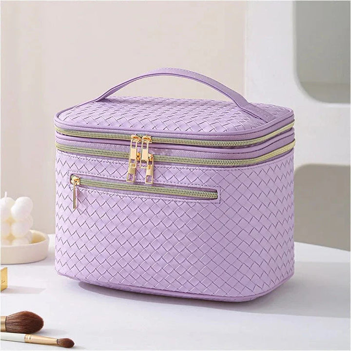 Trousse de toilette femme en cuir PU rose pâle, un vanity élégant et pratique pour les cosmétiques et le voyage.