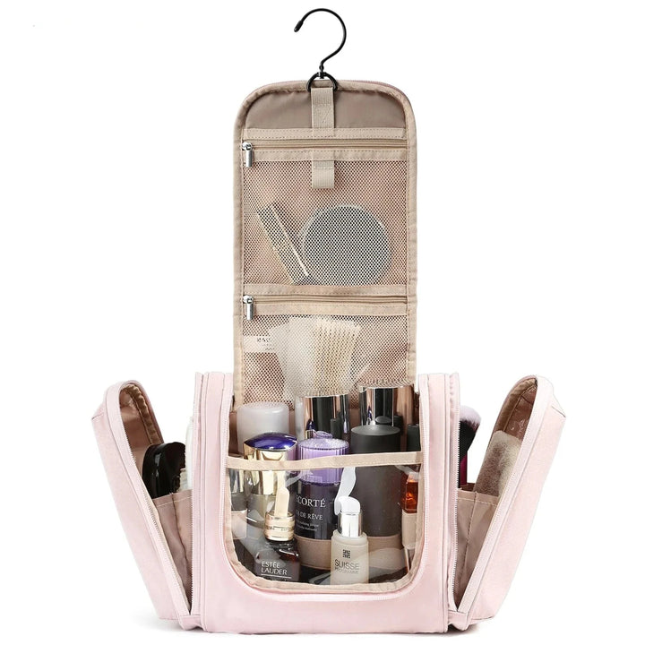 Trousse de toilette femme en cuir PU rose avec fermeture éclair dorée, idéale pour les cosmétiques de voyage.