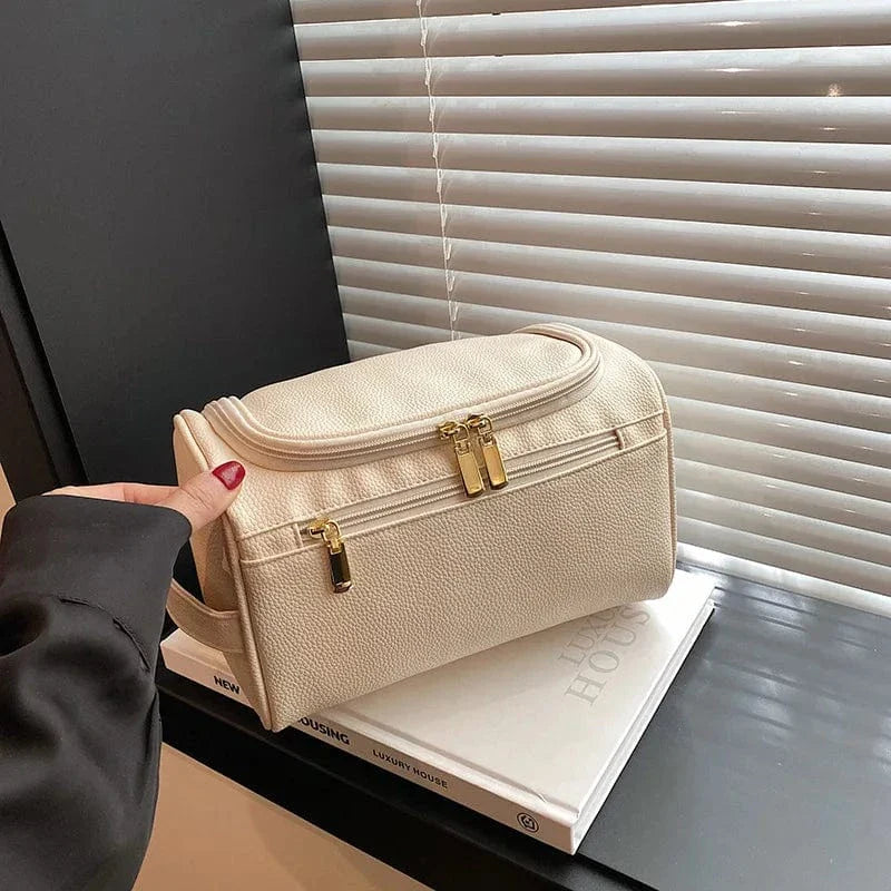 Trousse de maquillage rose imperméable pour femmes, fabriquée en cuir PU, parfaite pour les voyages et l'organisation.