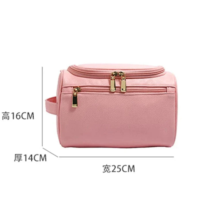 Trousse de toilette rose pour femmes avec fermeture éclair dorée, un accessoire chic pour le maquillage et les voyages.