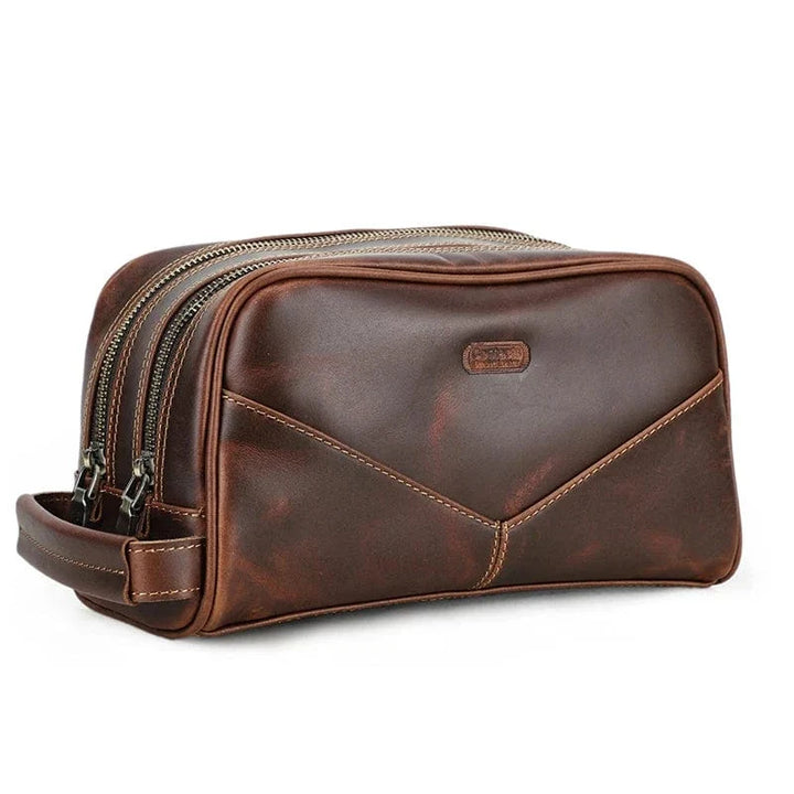 Trousse de toilette en cuir véritable avec fermeture éclair métallique, idéale pour l'homme moderne.