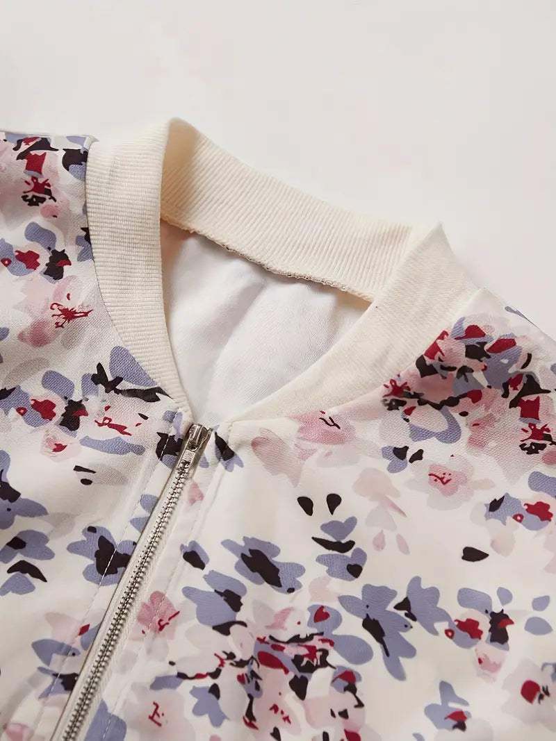 Veste bomber femme, imprimé floral léger, coupe chic et confortable.  Idéal mi-saison.