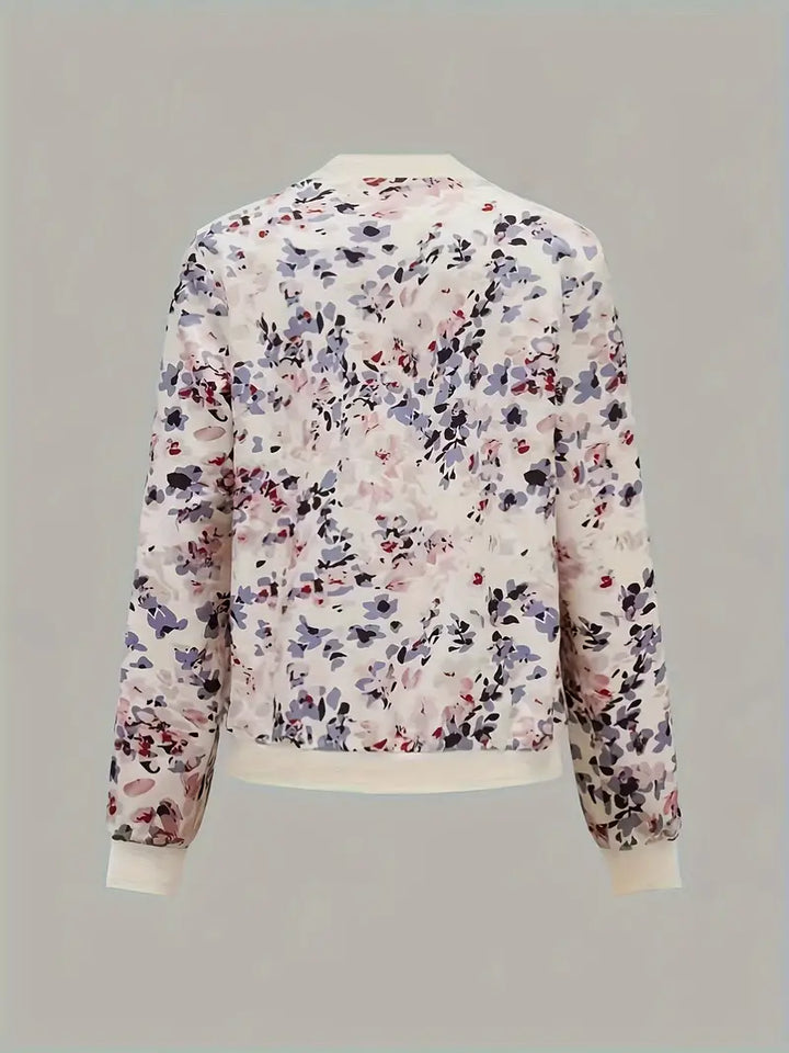 Veste bomber femme, imprimé floral léger, coupe chic et confortable.  Idéal mi-saison.
