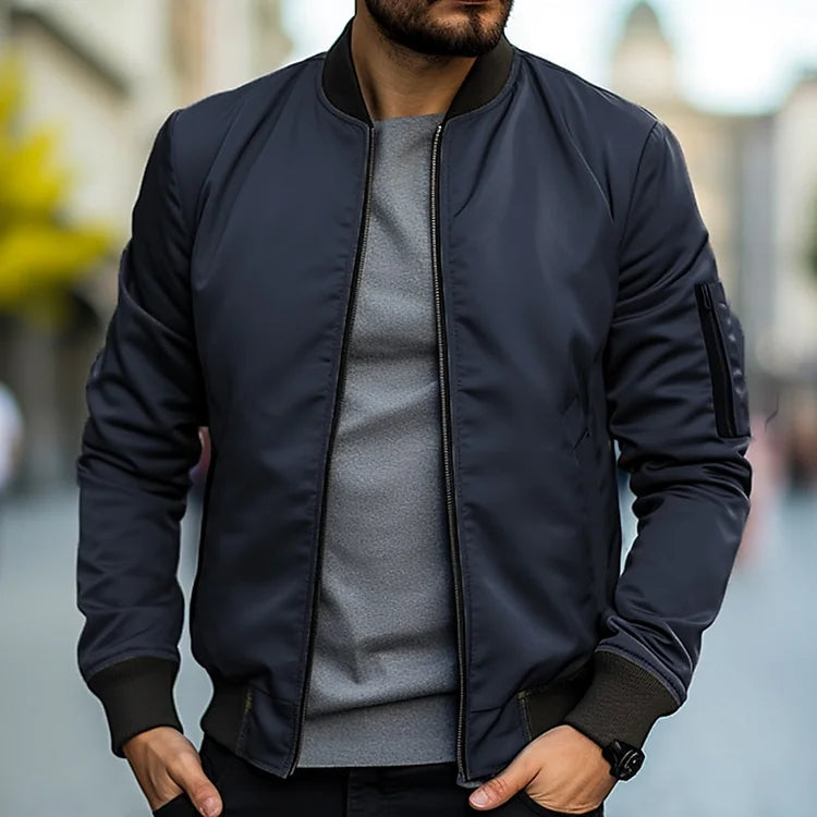 Veste bomber homme Linus noire, style décontracté automnal. Blouson coupe-vent urbain pour un look casual.