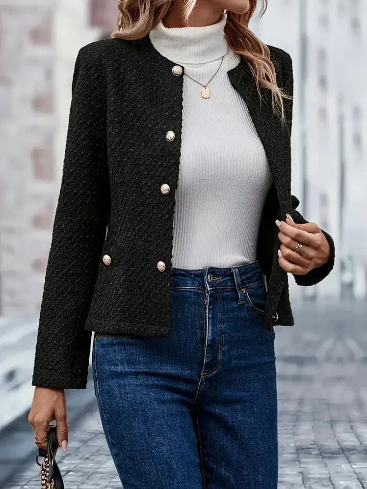Veste boucle femme élégante, coupe flatteuse, idéale pour le bureau ou les soirées.