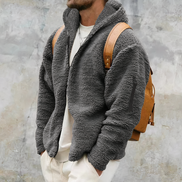 Manteau d'hiver homme Sherpa élégant, zippé à capuche, offrant chaleur et protection pour un style casual.