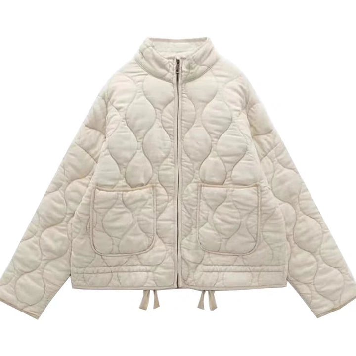 "Veste femme matelassée Yvette grise, design ondulé chic, poches pratiques, idéale mi-saison"