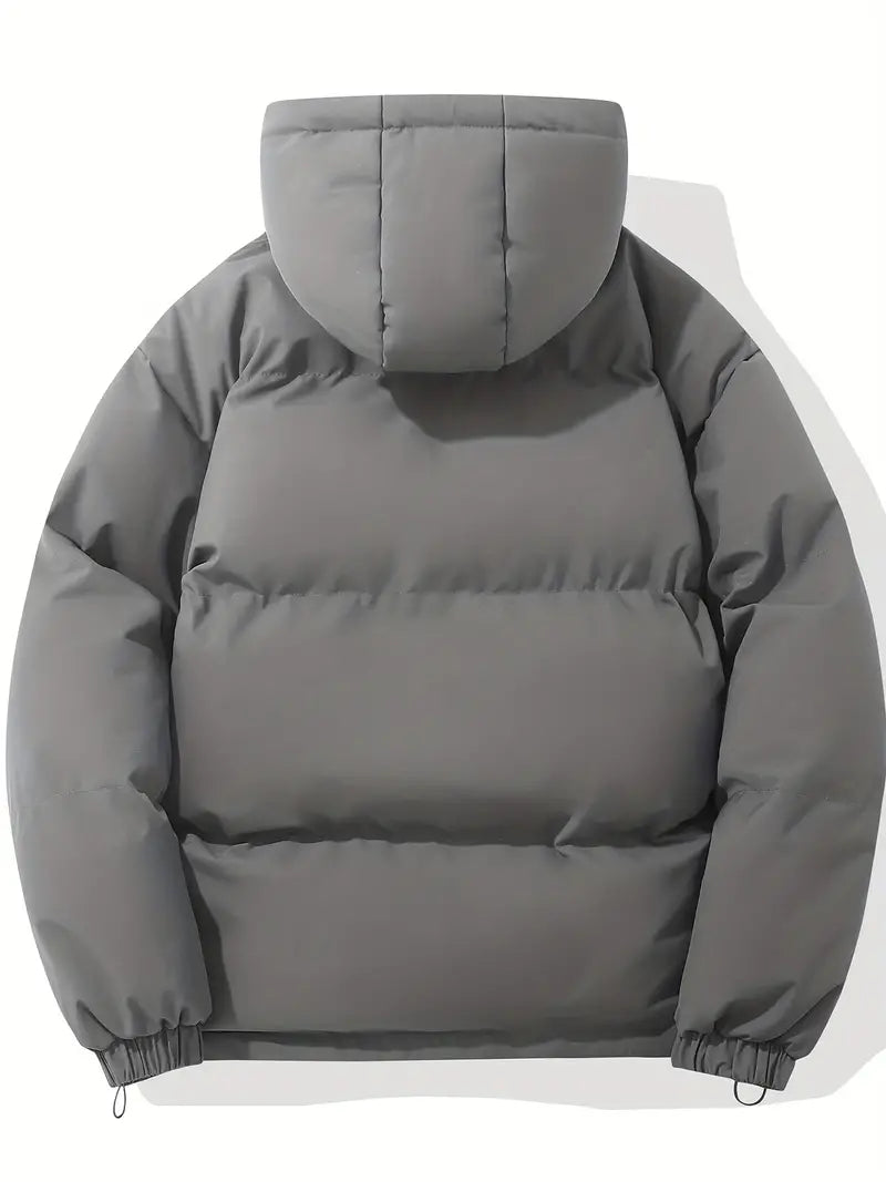 Élégante veste matelassée femme avec capuche, chic et chaude, idéale pour la mi-saison.