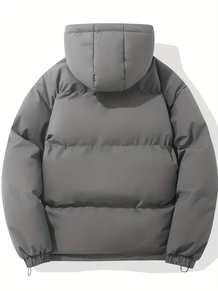Élégante veste matelassée femme avec capuche, chic et chaude, idéale pour la mi-saison.
