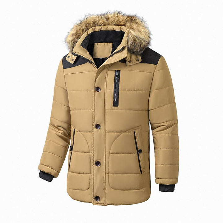 Homme portant une veste d'hiver matelassée isolante, parfaite pour le froid, le confort et l'extérieur.
