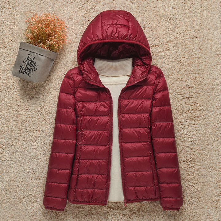 Veste femme matelassée compressible, ultra-légère et chaude, essentielle pour le voyage hivernal.