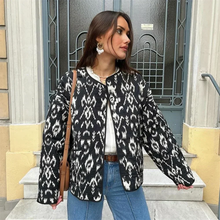 Veste matelassée femme, imprimé élégant, coupe moderne, chaude et confortable. Polyester durable.