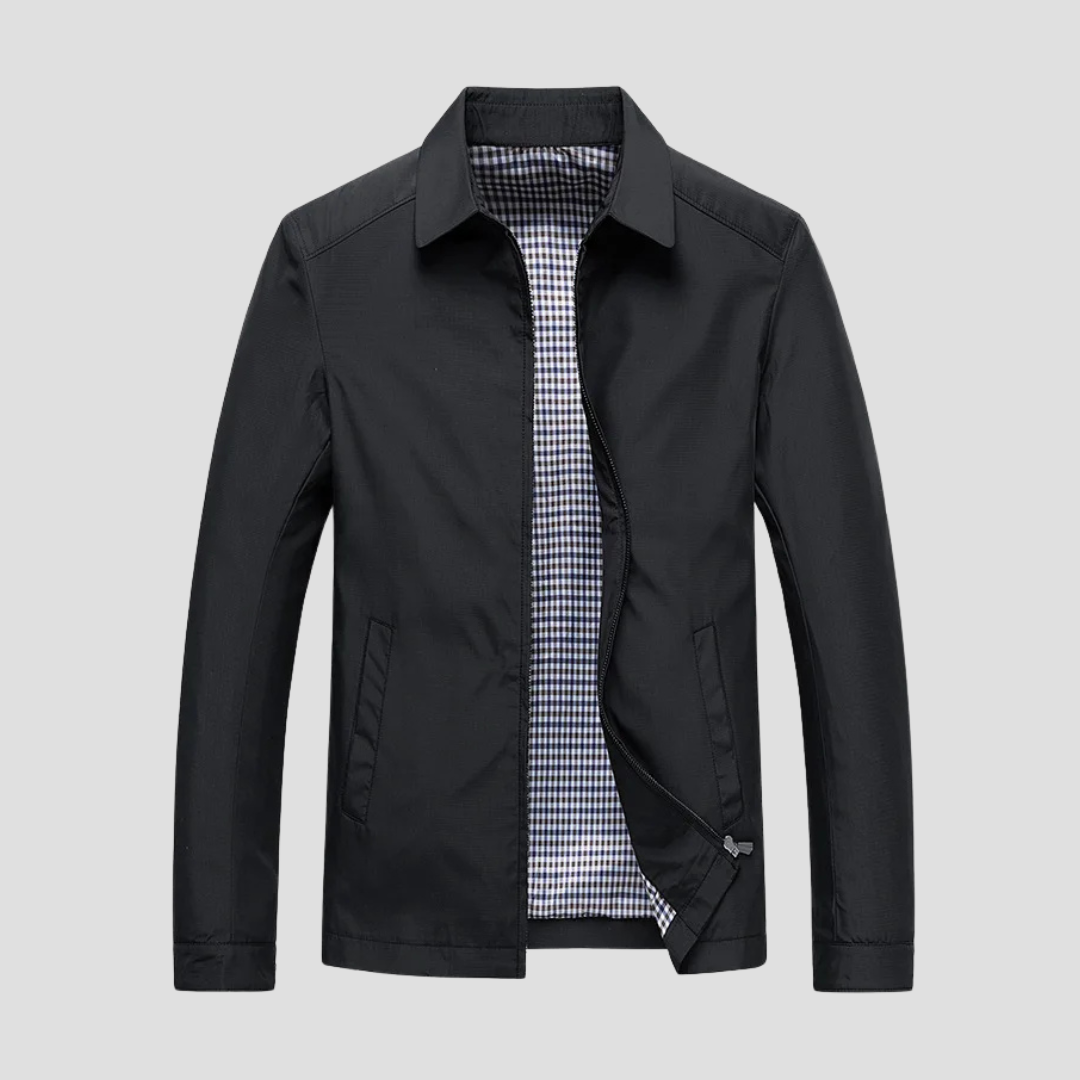 "Veste zippée imperméable homme, style urbain, couleur marine, col pointu, doublure à carreaux, fermetures discrètes."