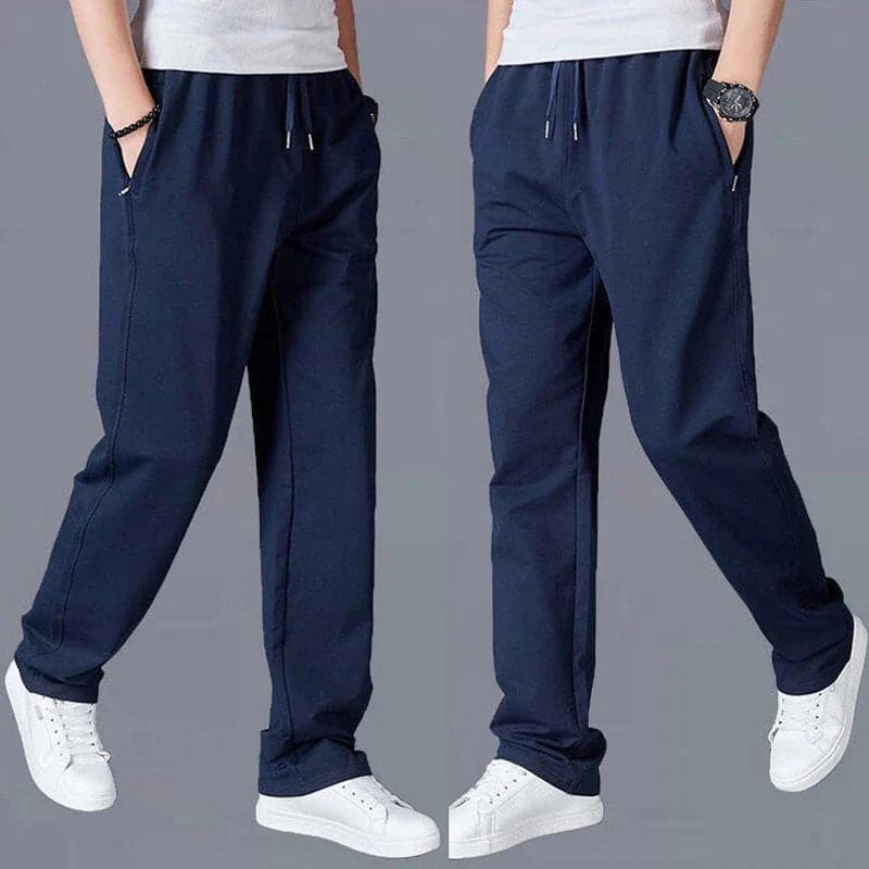 "Vue avant pantalon fuselé noir pour homme, design élégant et moderne, confort optimal, poches zippées, coupe ajustée"